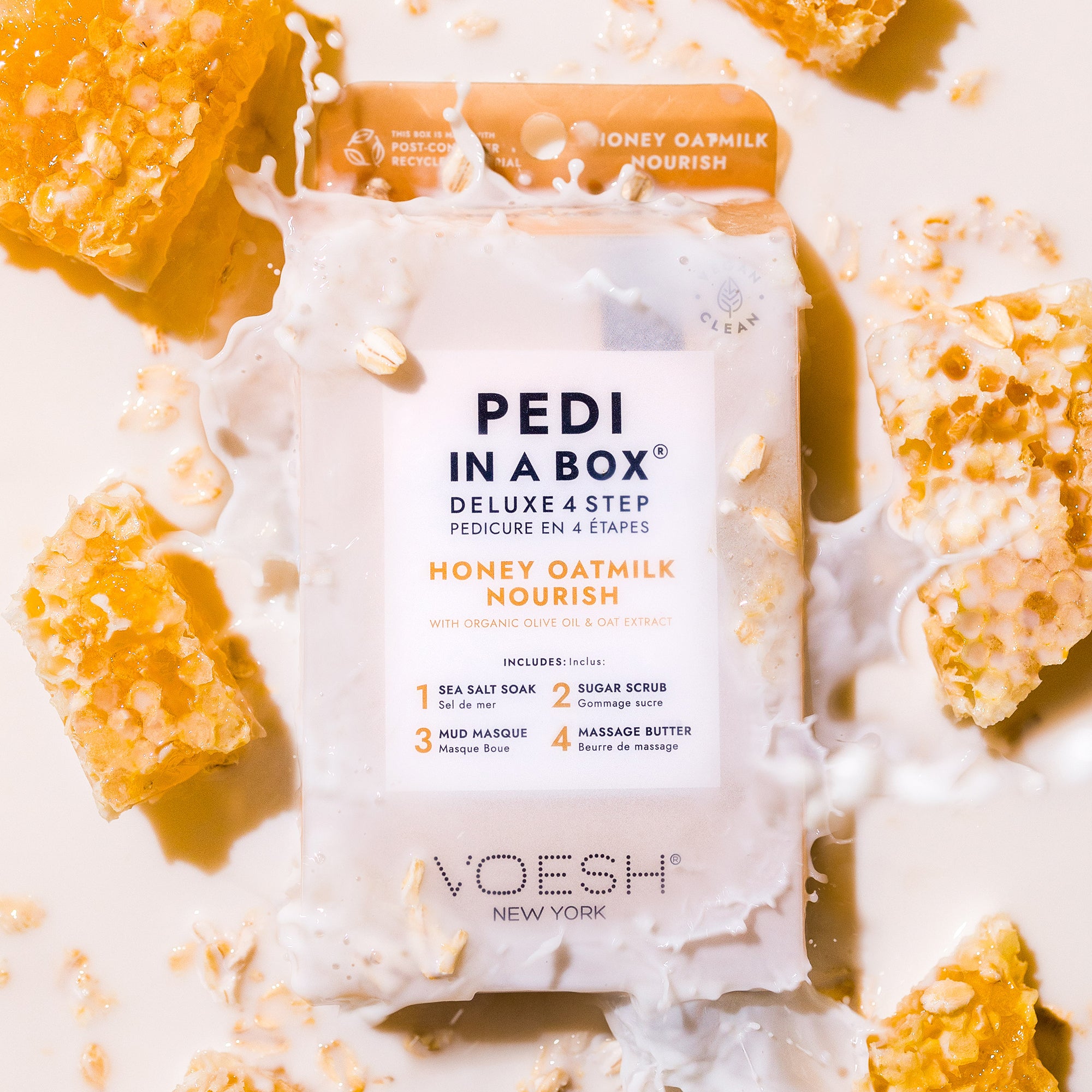 Honey Oatmilk Nourish Pedi in a Box Deluxe 4 Step with oatmilk splashing on the top, and honeycombs surrounding it